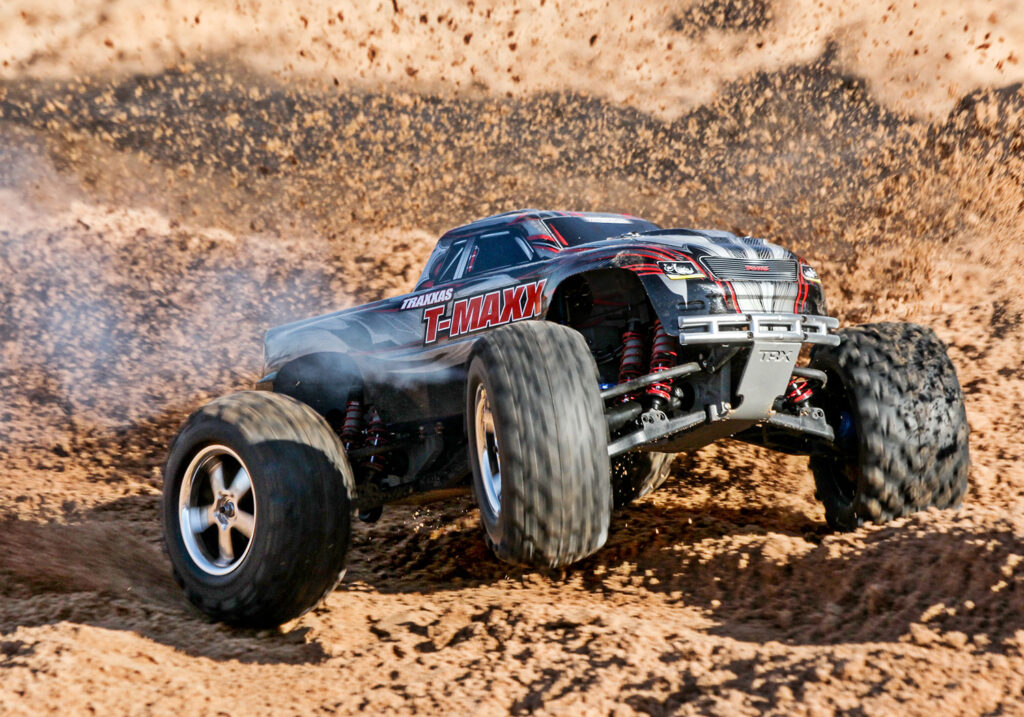 brand new traxxas-tmaxx 3.3 nitro monster truck running in the dirt